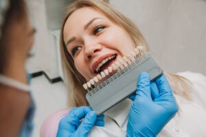 dentist picking color of veneers