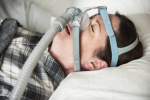 person using a sleep apnea device