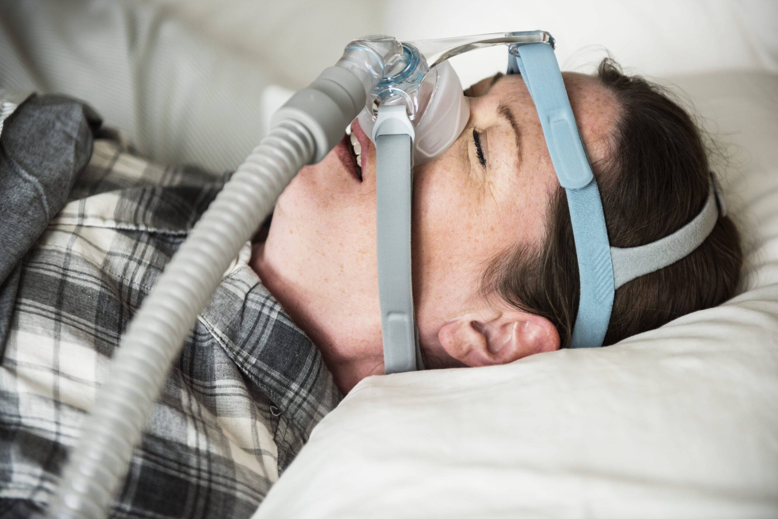 person using a sleep apnea device