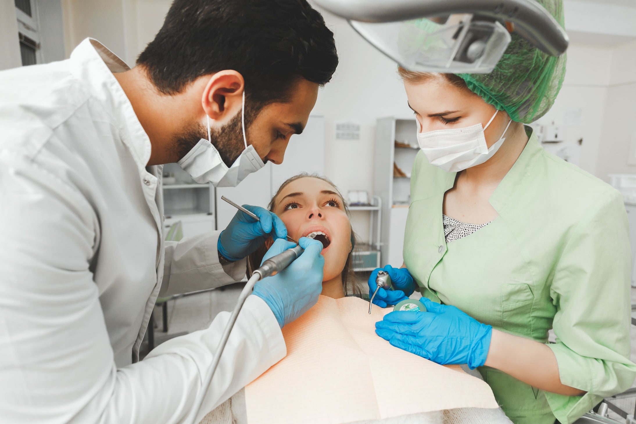 dentist and assistant working on patient