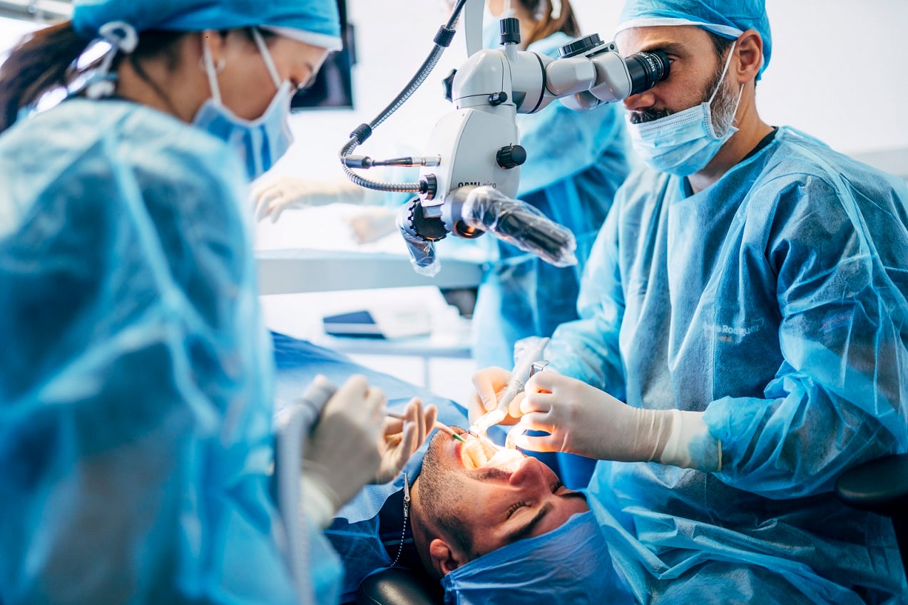 dental surgeons working on a patient